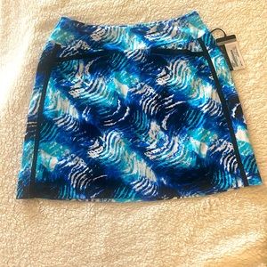 TAIL High Tide women’s golf/tennis skort.  Blues, black and white.  NWT X Small.